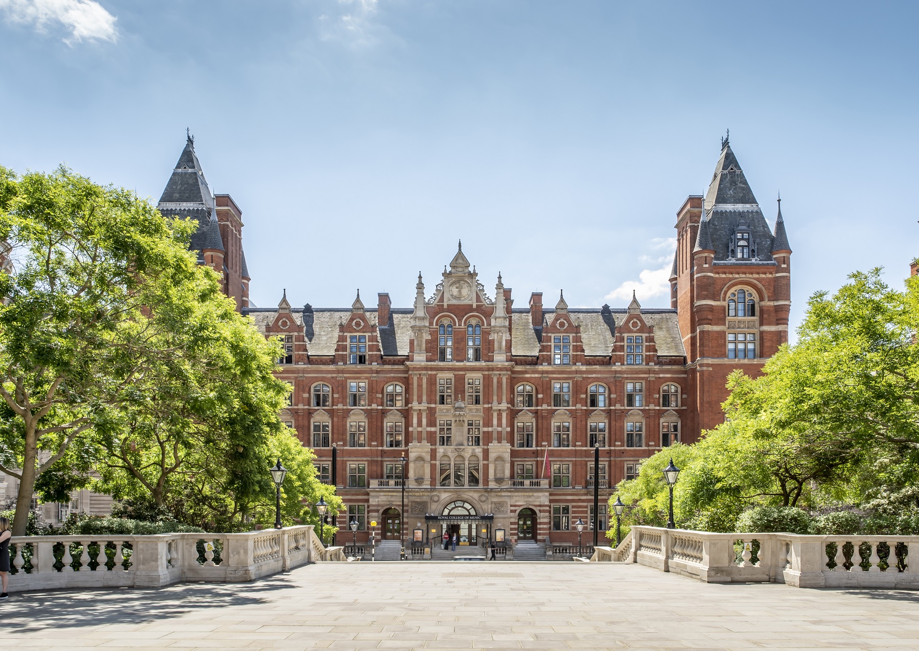 Landscape photo of the front entrance of the Royal College of Music on a sunny day.